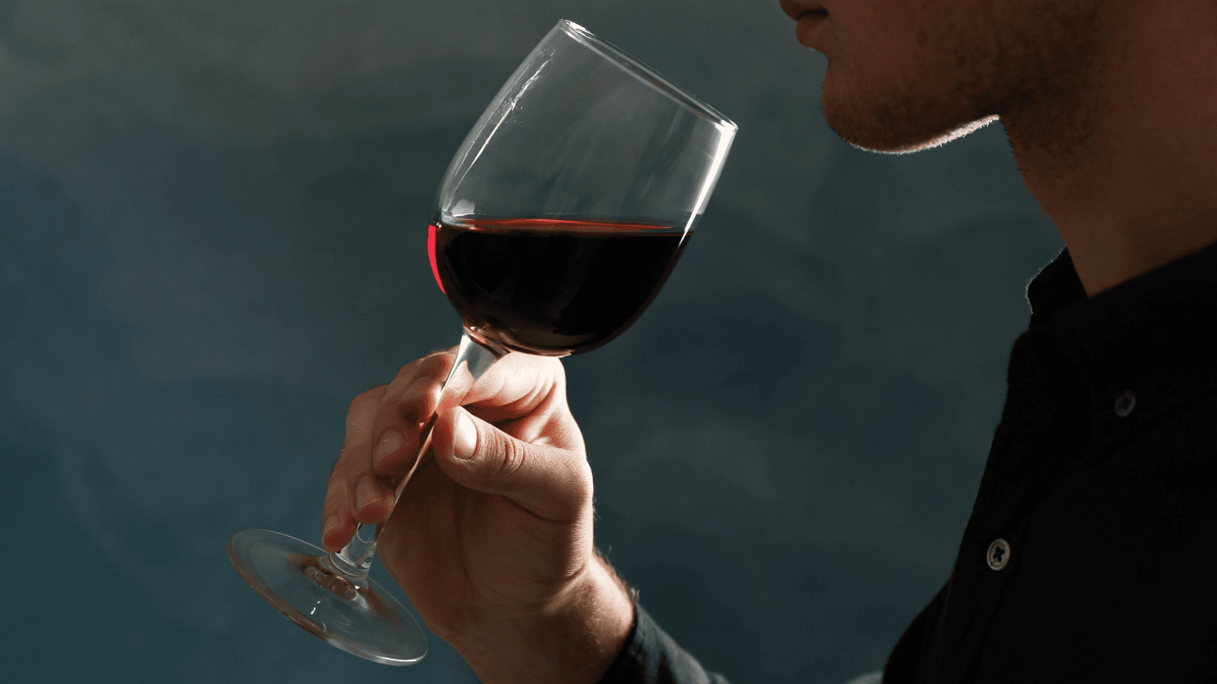 Man drinking red wine