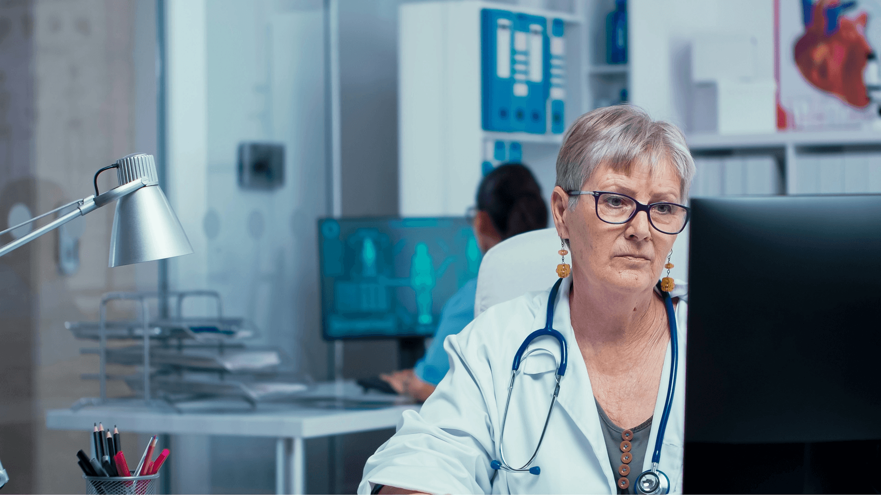 A doctor working on her computer