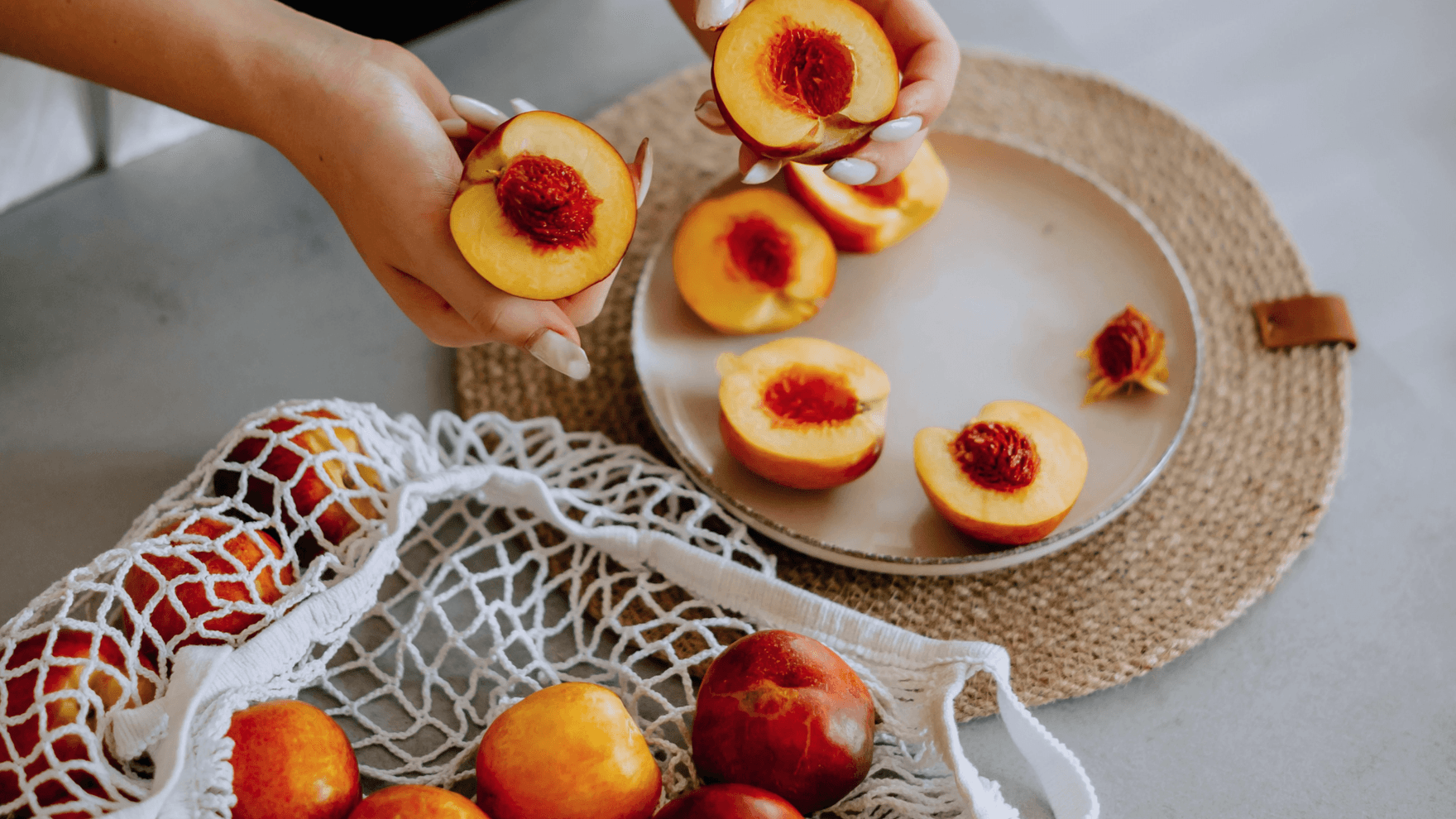 A woman with a bag of peaches