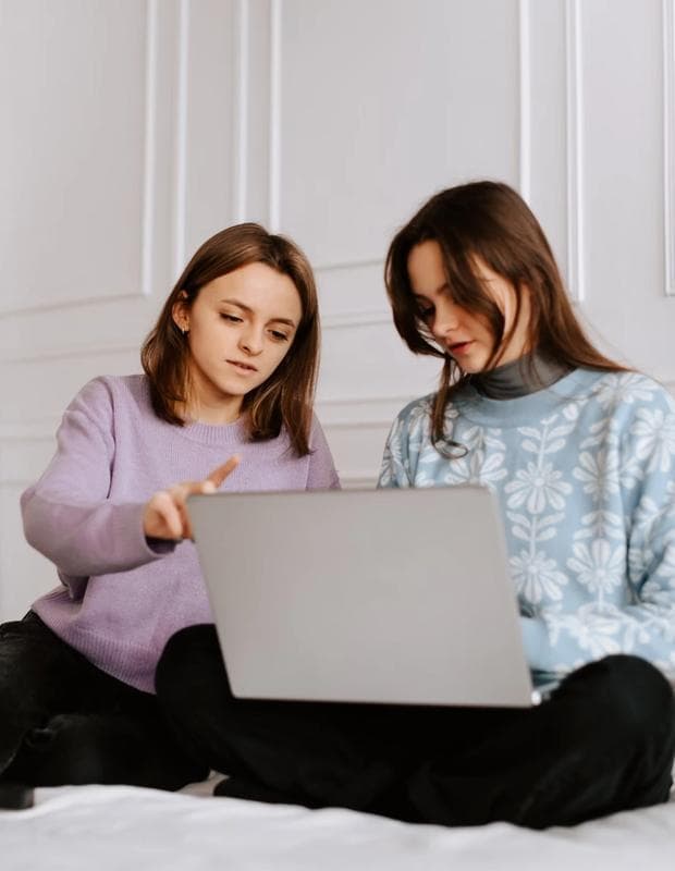 Girls Checking Laptop