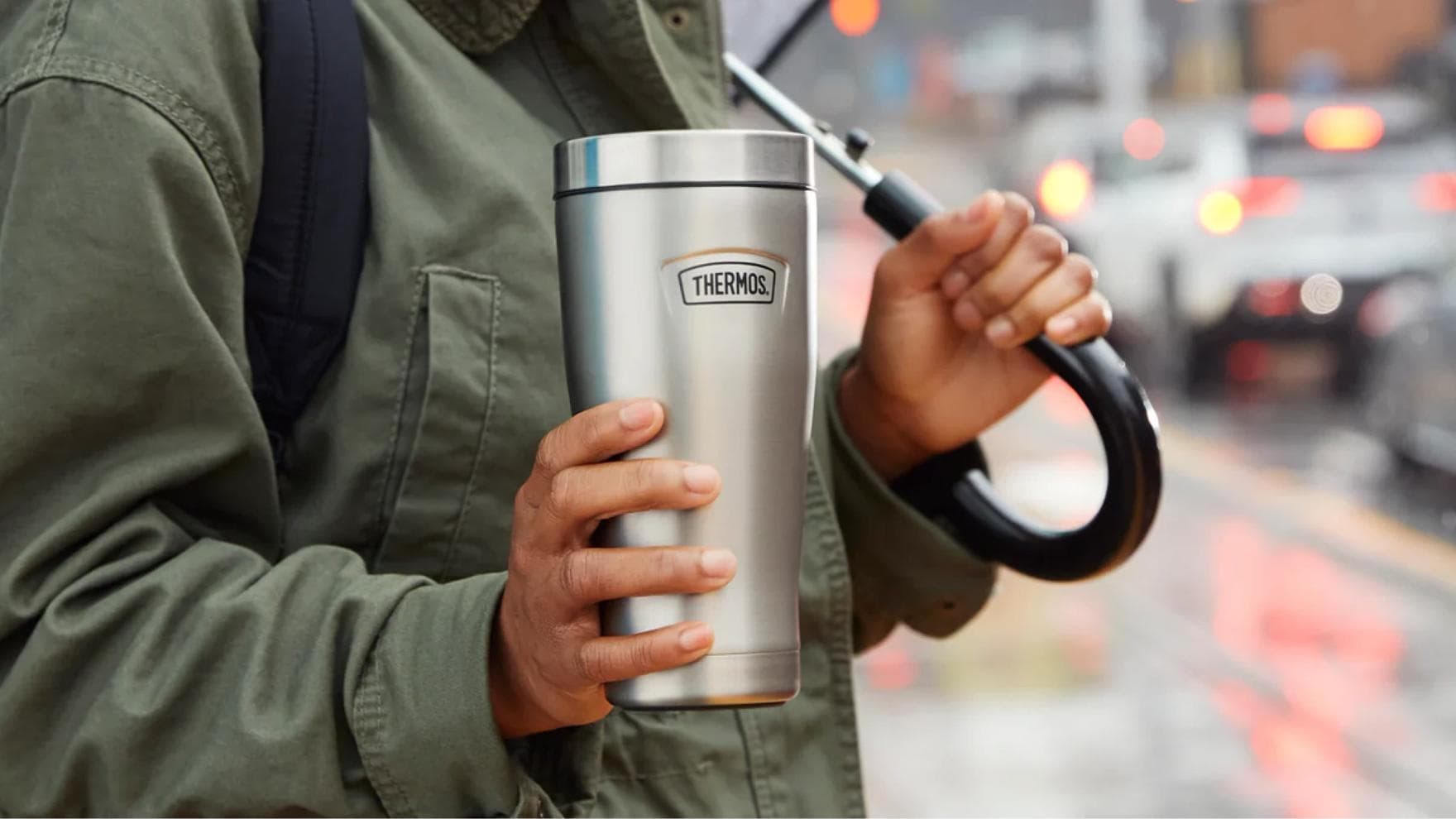 Man using Thermos timbler