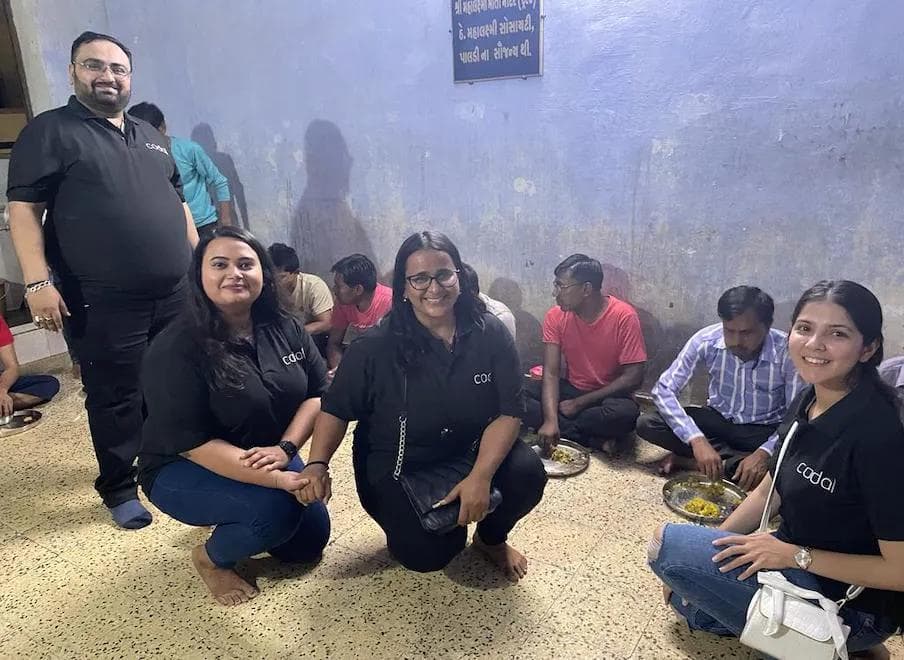 Codal employees serving plates of food to the blind