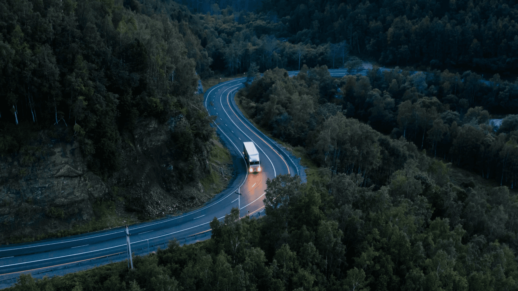 Cargo truck on the road at night