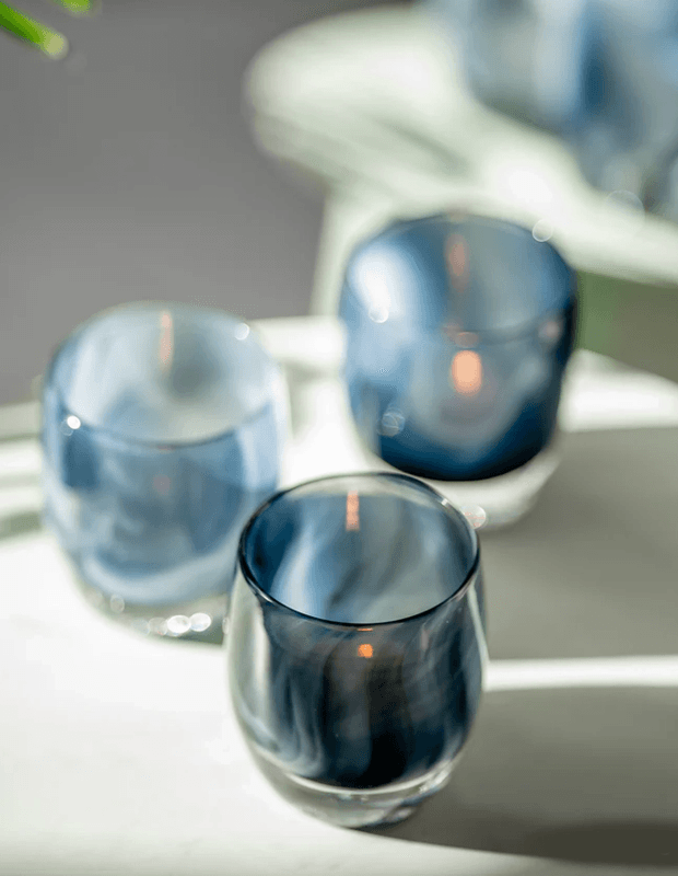 candles in glassybaby blue jars 