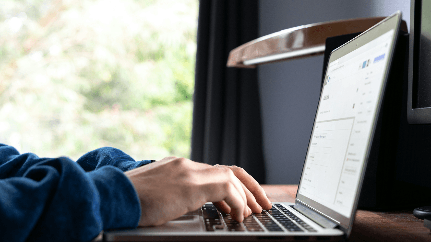 Hands typing on a keyboard