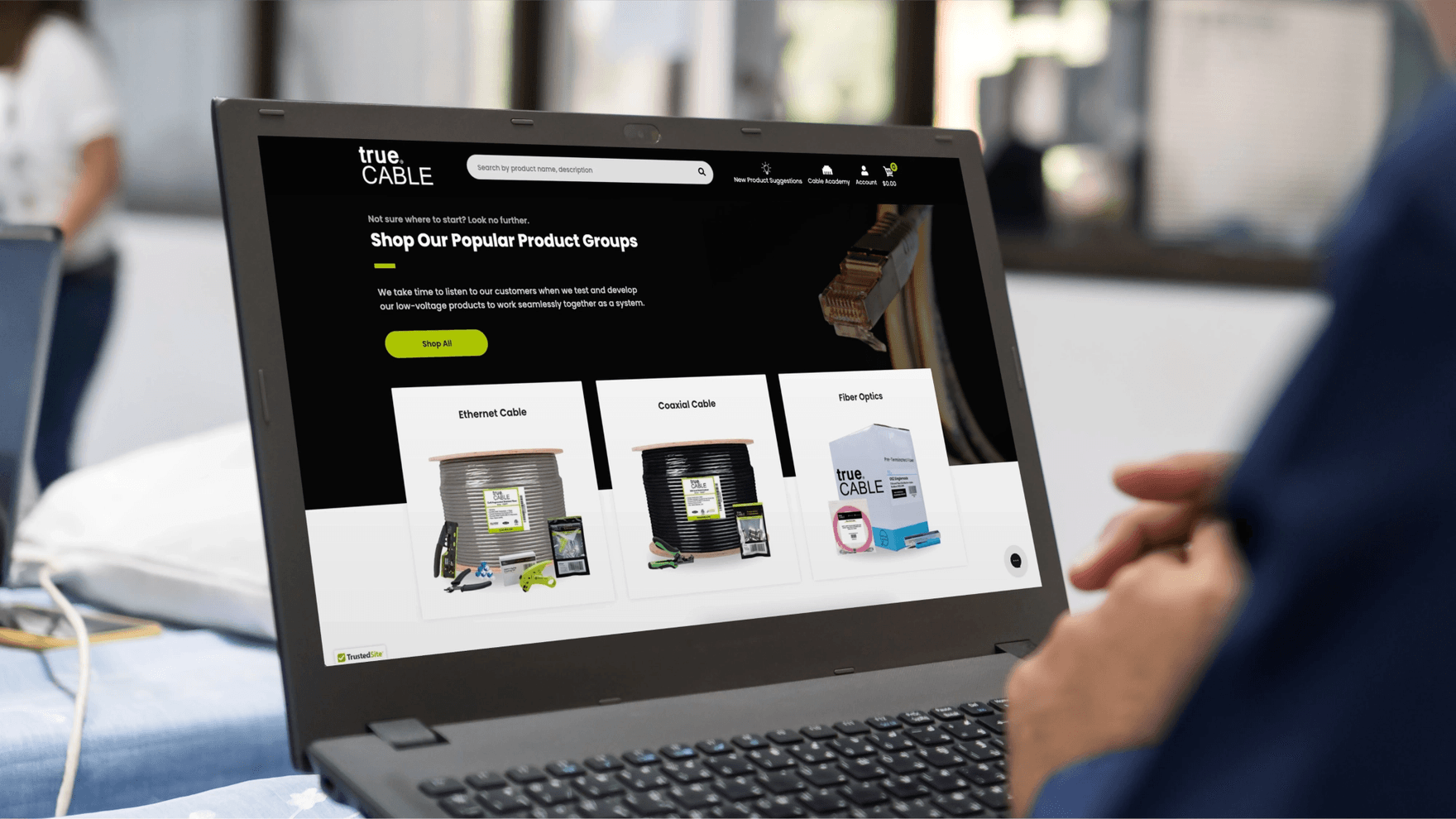 Person browsing TrueCABLE website in laptop