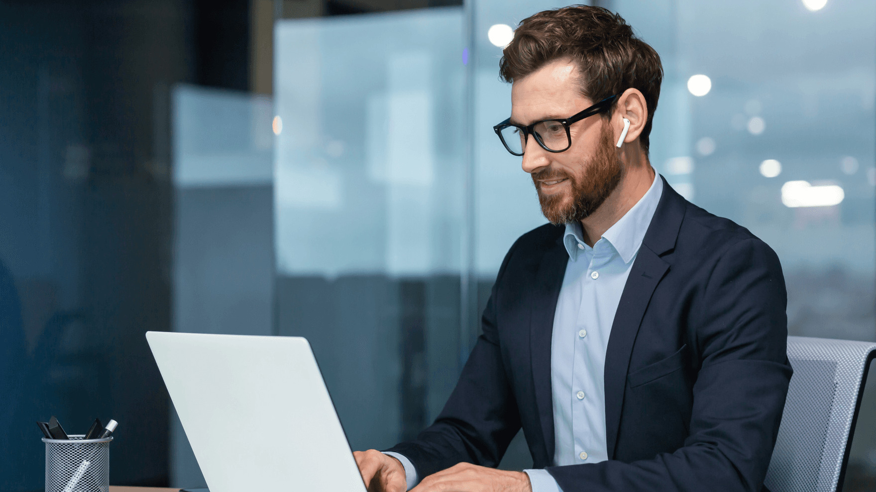 Businessman at work with laptop inside office