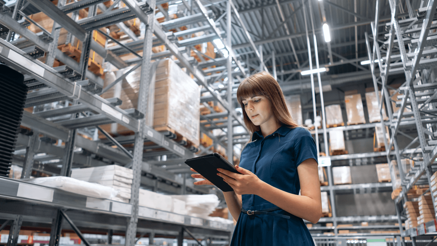 Woman in factory with tablet