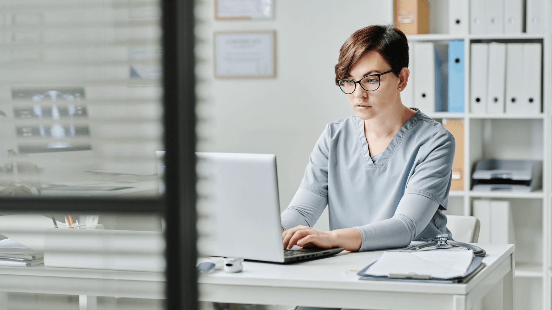 A doctor working on the computer