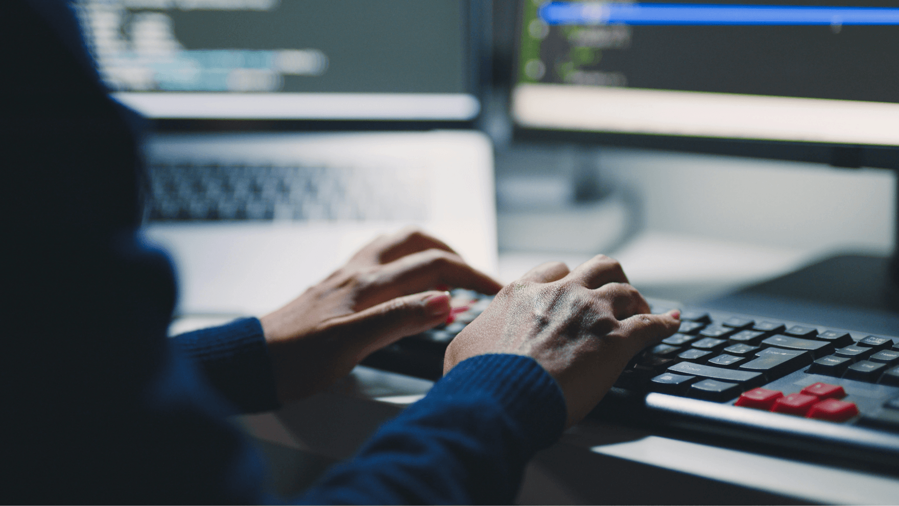 Mann writing code on a computer