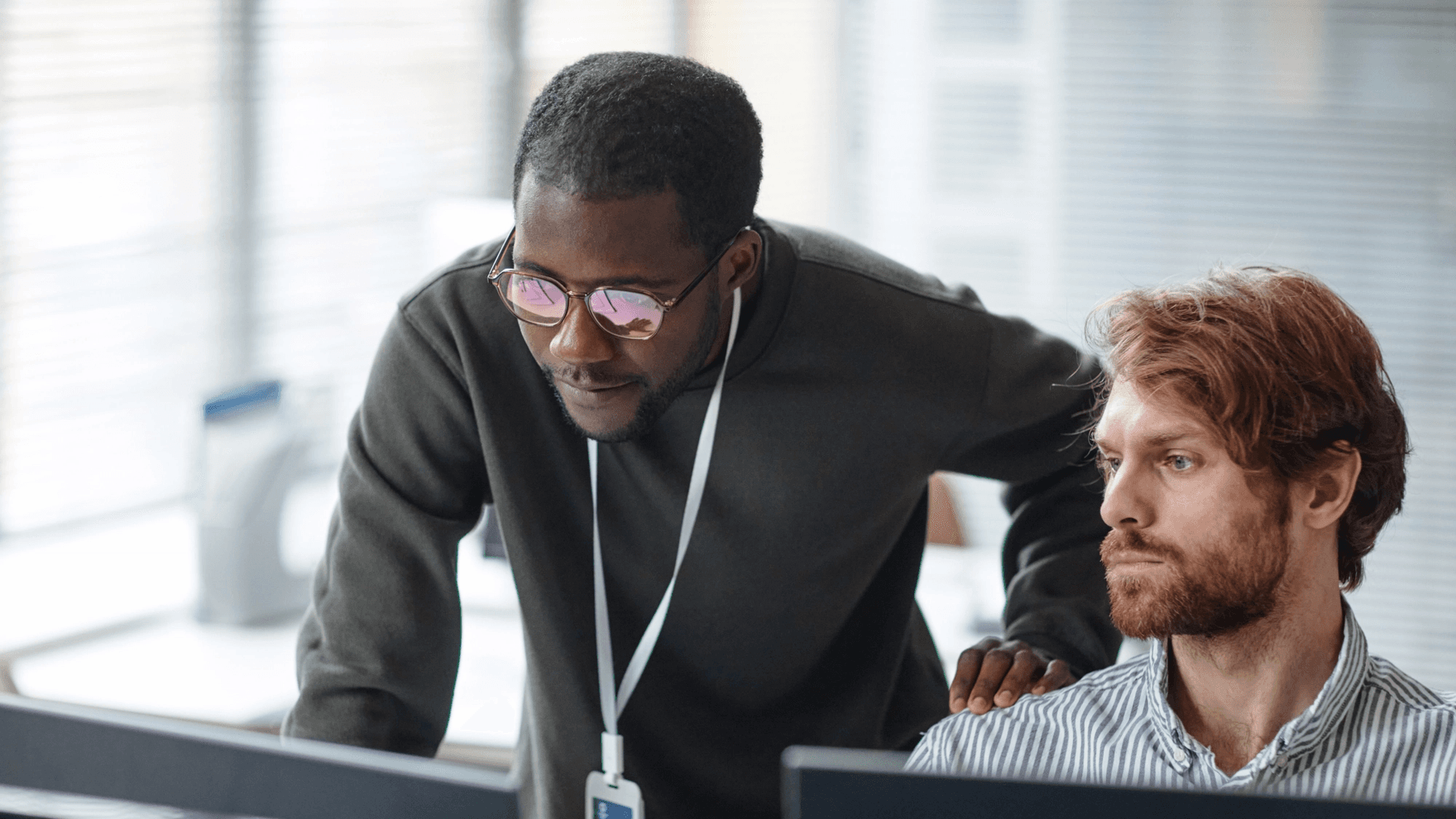 Two men working on a computer