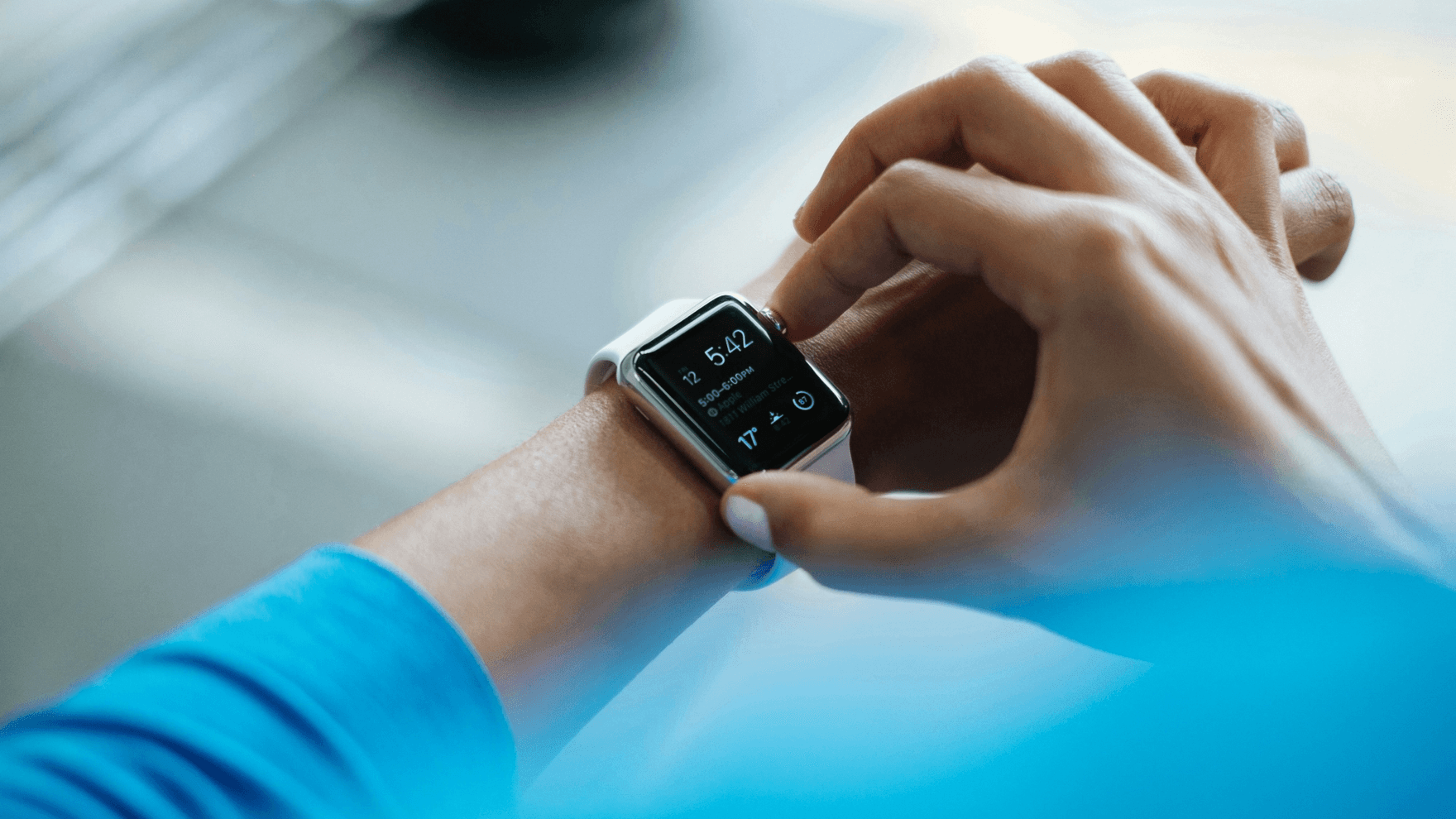 Man checking smartwatch while exercising 