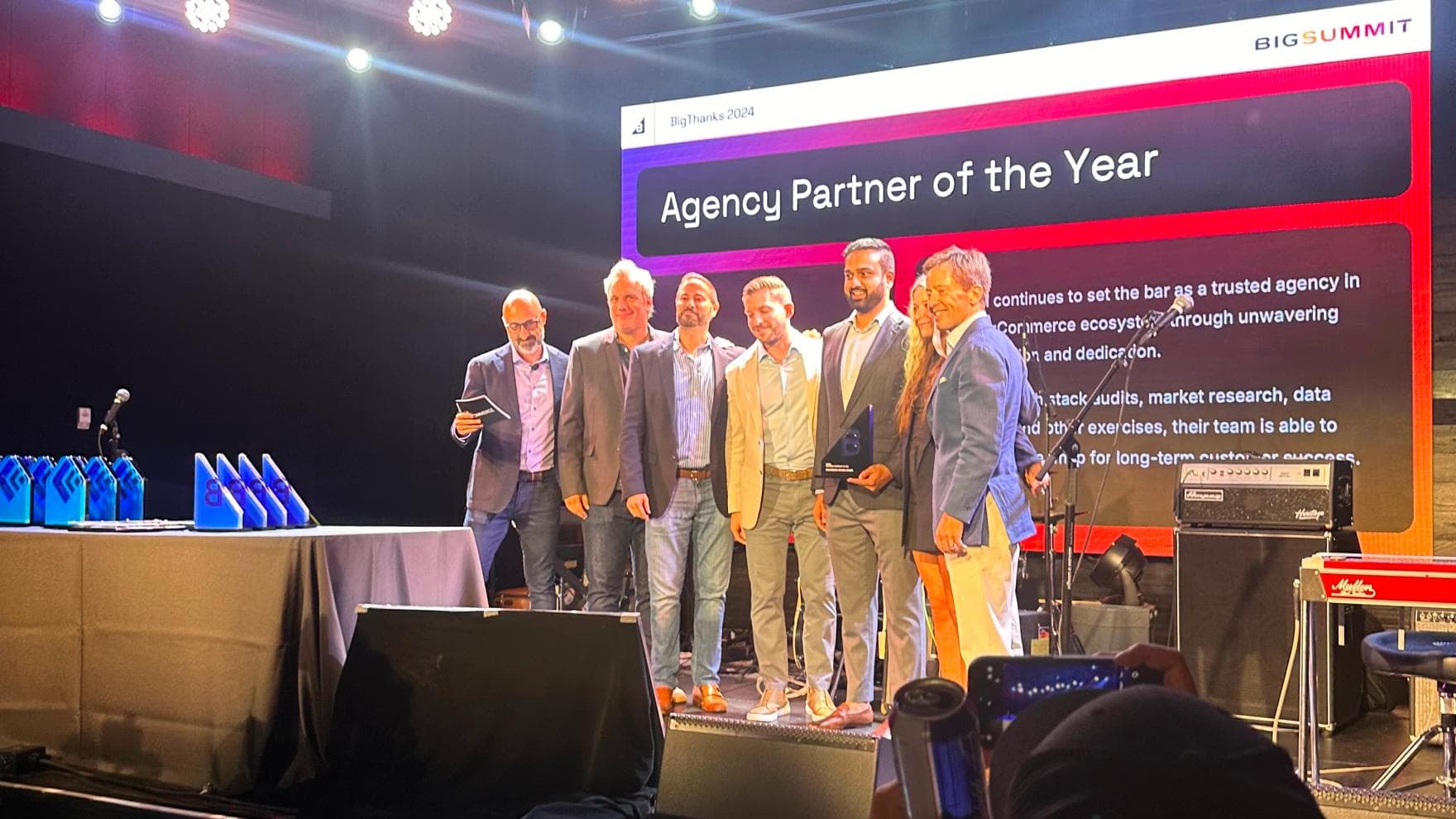 Codal leadership team accepting Agency Partner of the Year award at BigCommerce Summit