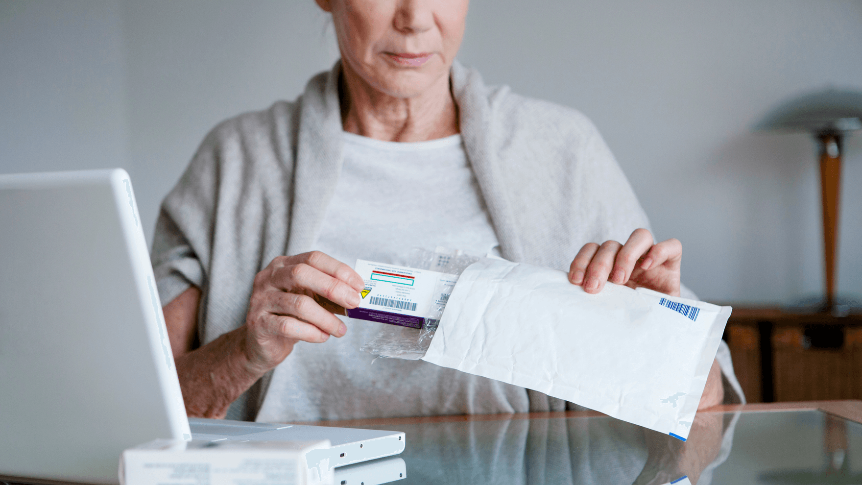 Senior woman receiving medicines bought on internet