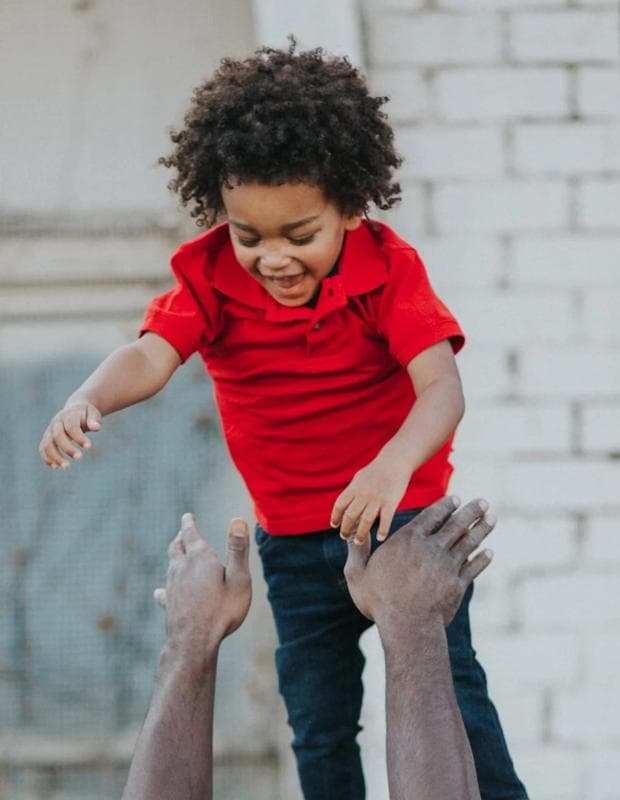 Child playing with father