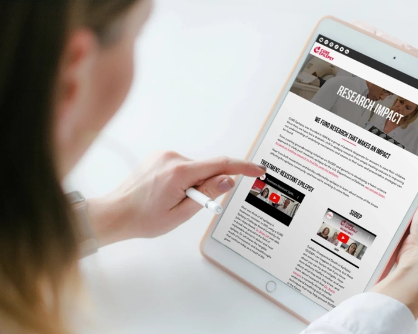 Doctor browsing Cure website