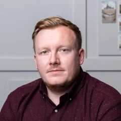 Headshot of Joe Comins