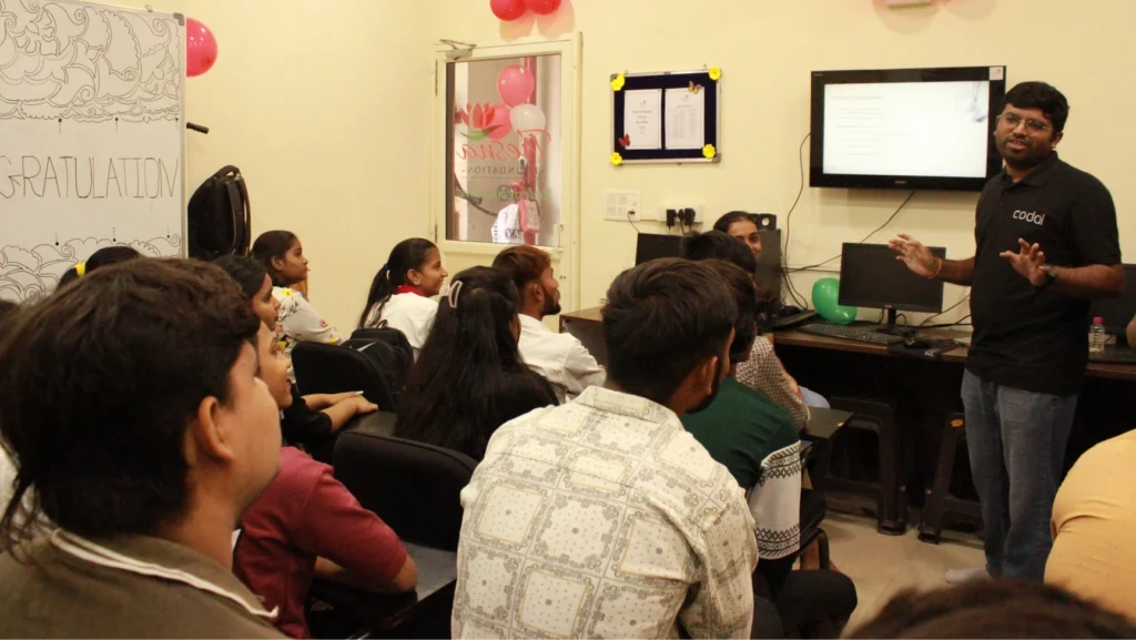 Codal employee presenting to students at the Tresna Foundation 