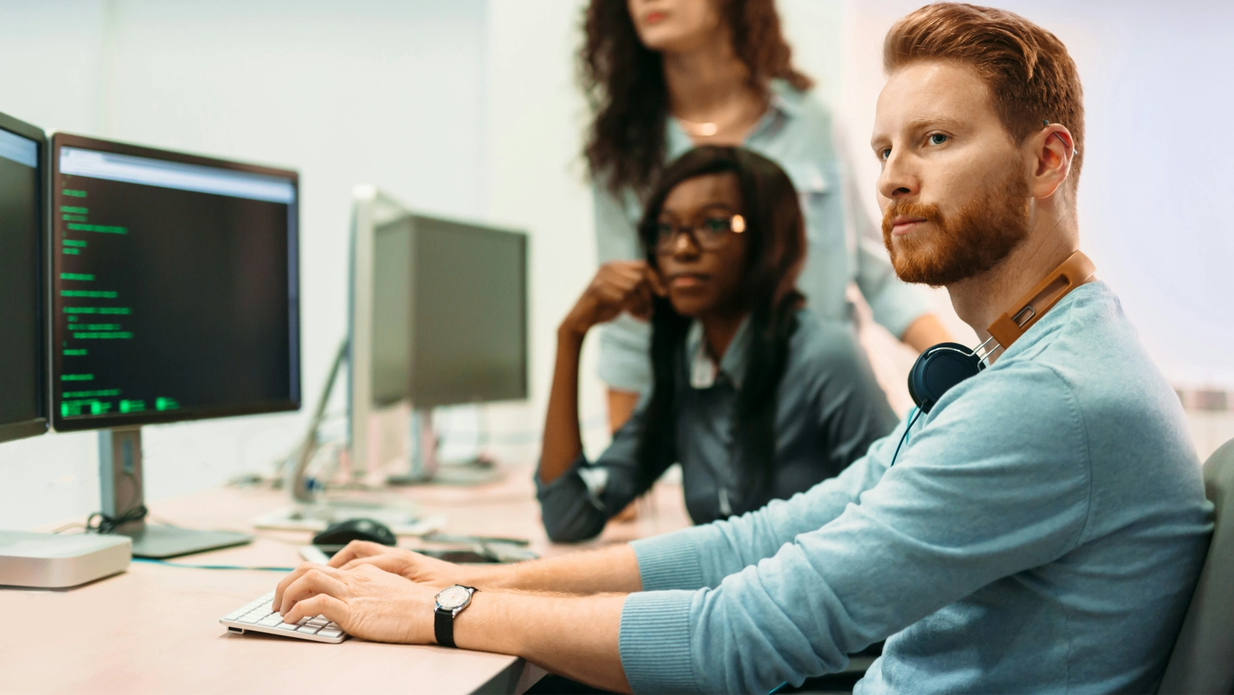 Man typing code on a computer