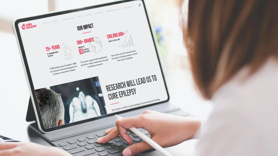 Woman looking at the CURE website on her tablet