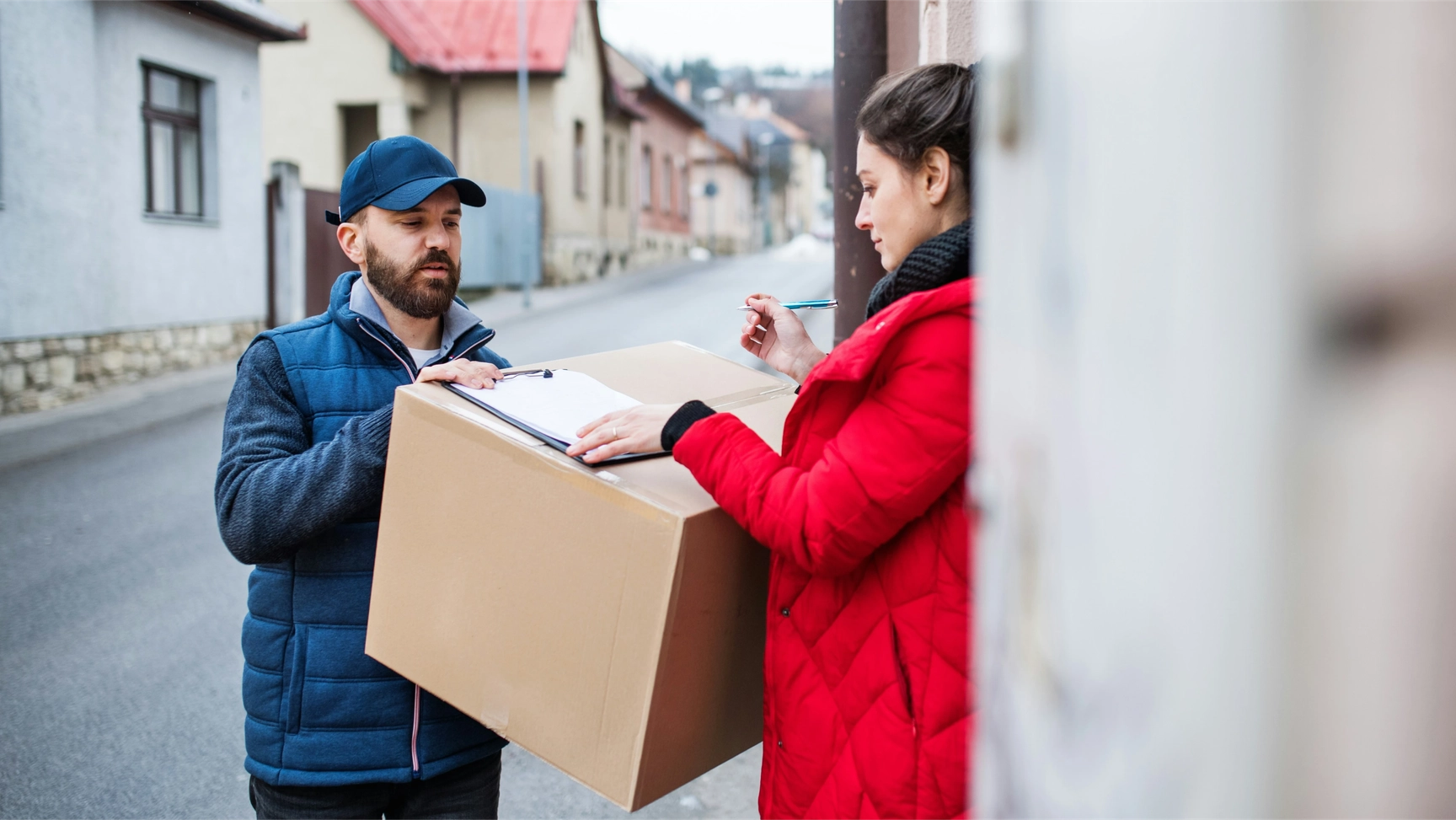 Woman receiving package showcasing the shipper's eCommerce expertise