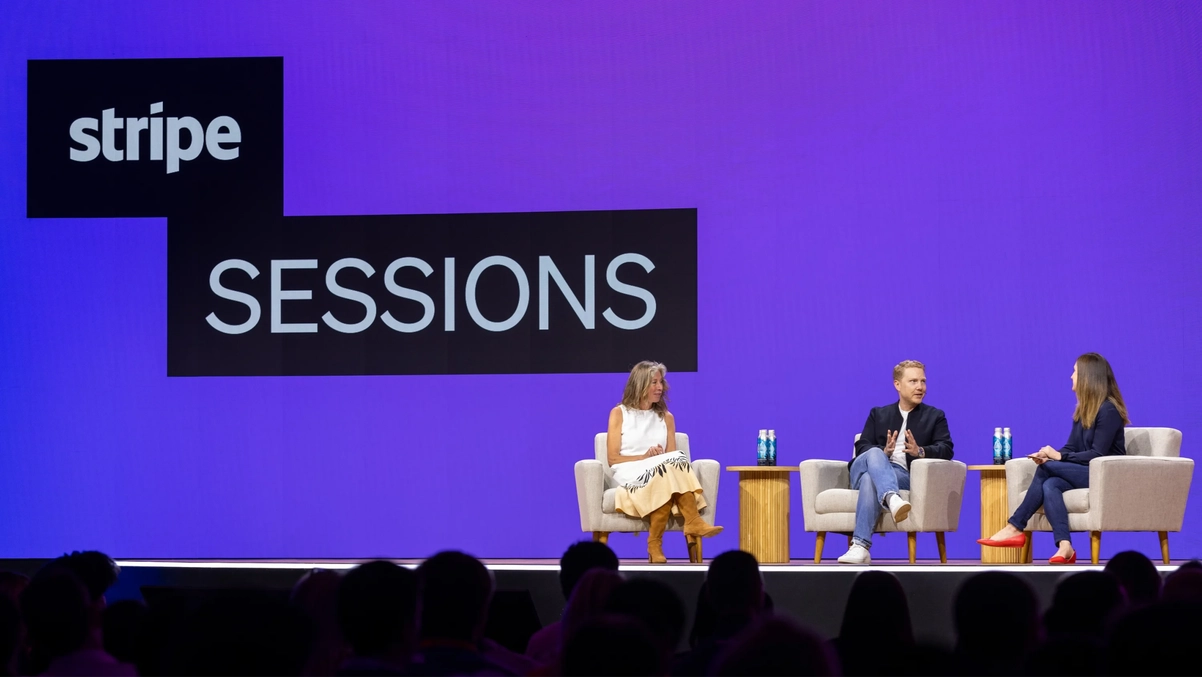 3 People debating on stage at Stripe event