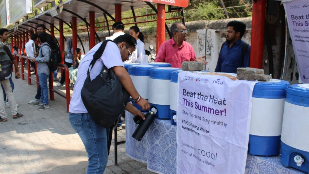 Codal's AMD, India, team passing out water for Global Volunteer Month 