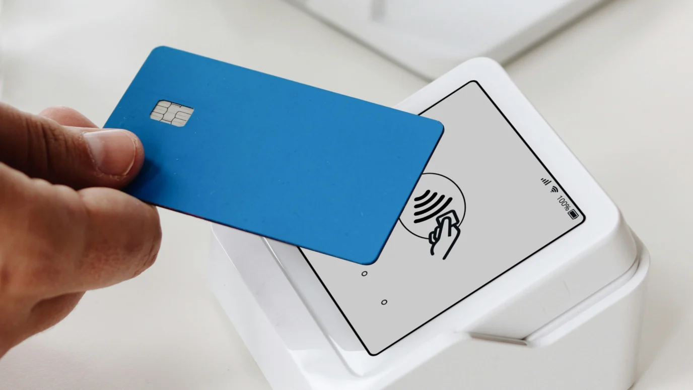 Person using a laptop to shop online for furniture, featuring a browser extension integration displaying available discount coupons at checkout.