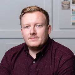 Headshot of Joe Comins